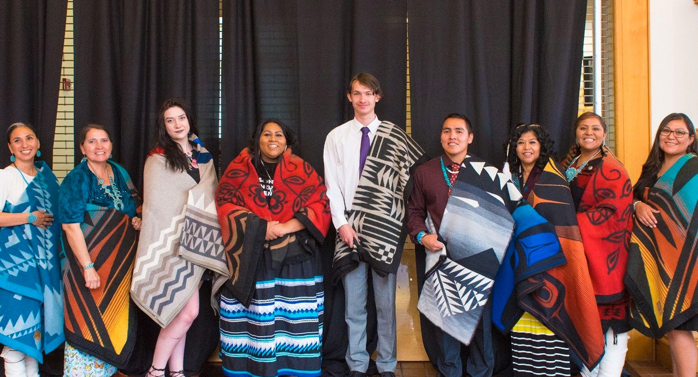 native americans with traditional blankets