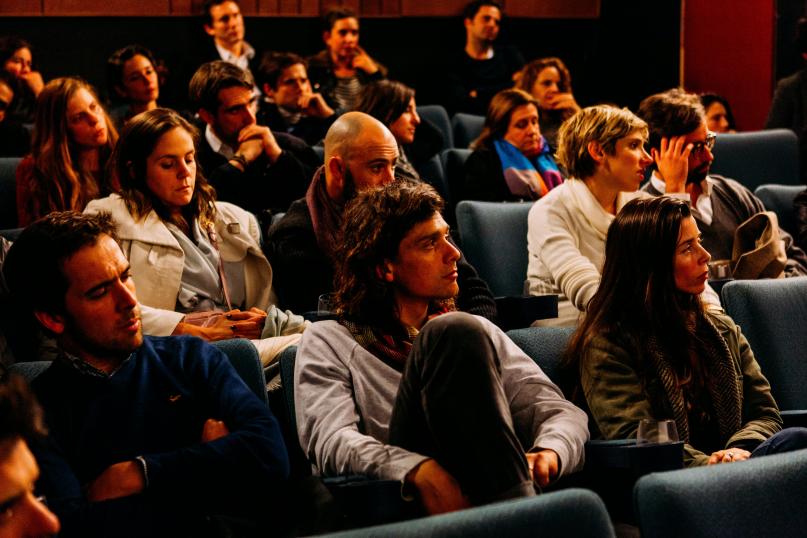 A group of students listening in on a lecture.