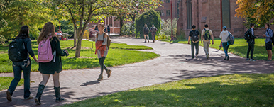 students walking on path along campus