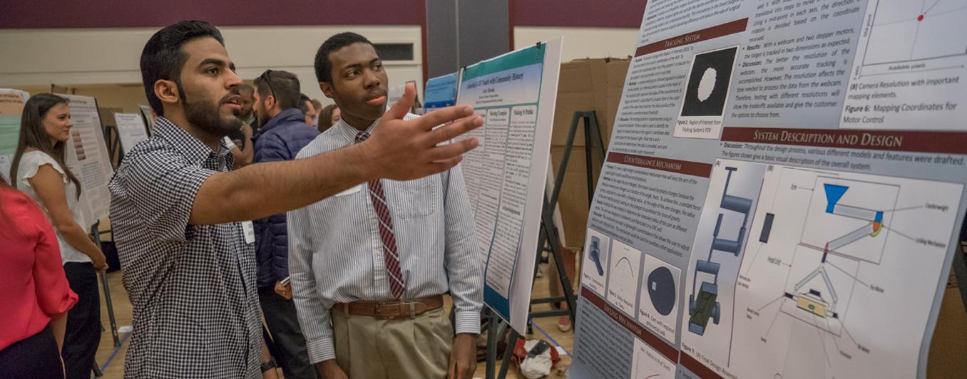 students looking at data on display